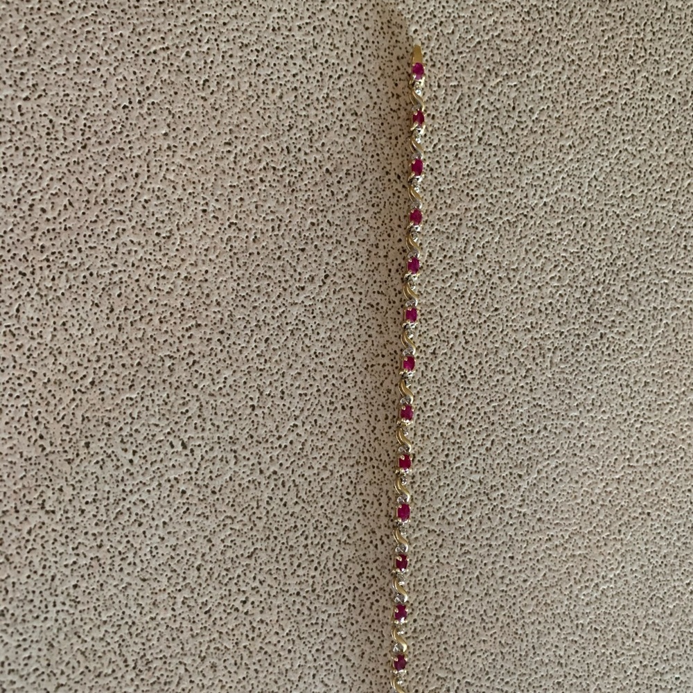 Ladies 7 1/4 inch ruby and diamond tennis bracelet